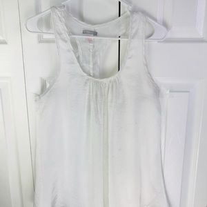 White Blouse with Flights in the back.